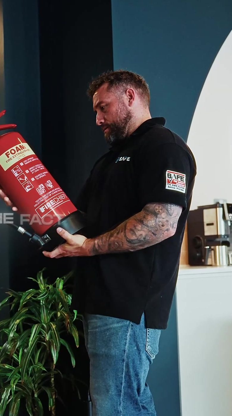 SAFE engineer servicing fire safety equipment