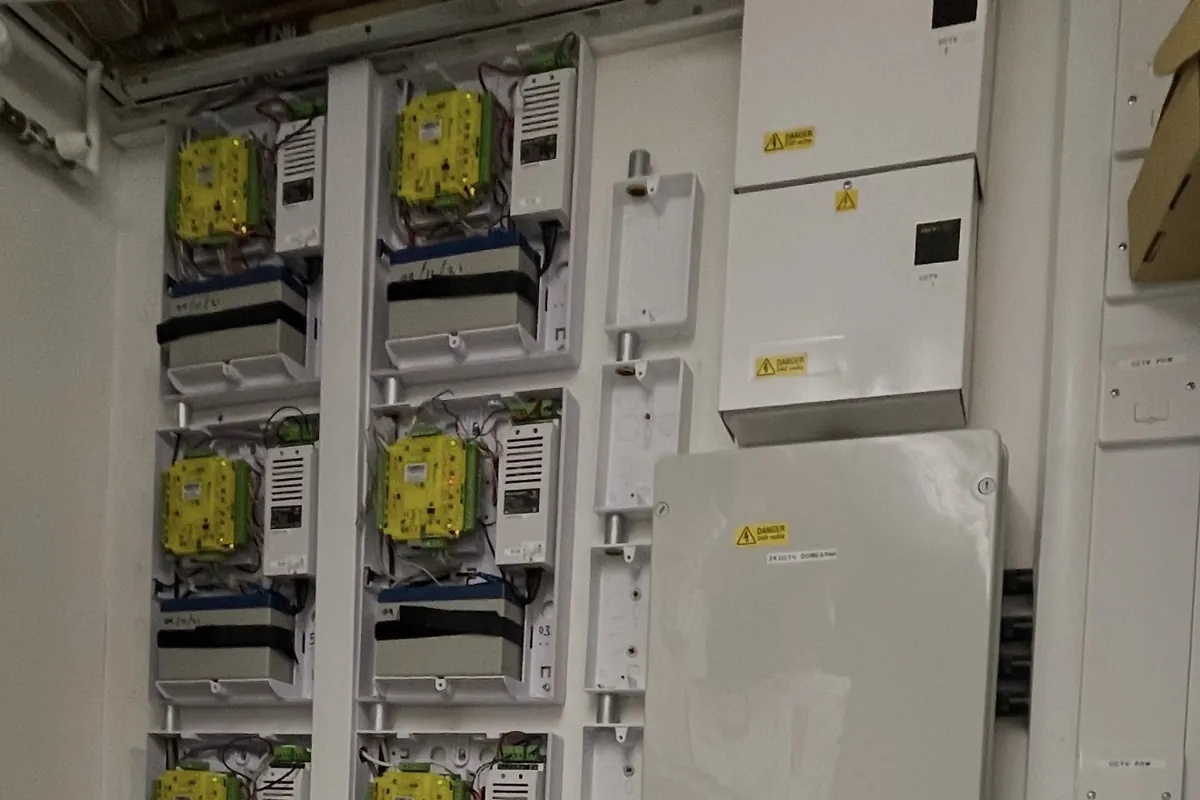 Access control door controllers and power supplies installed on a plant room wall by SAFE Fire & Security