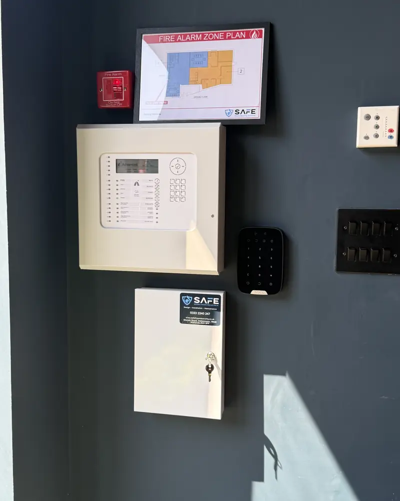 Addressable fire alarm panel with a SAFE fire alarm zone plan above it