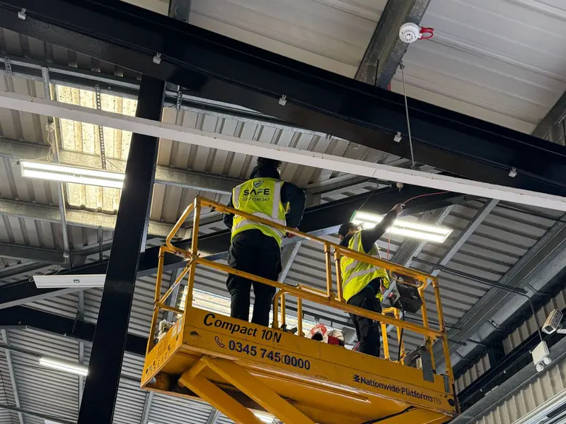 SAFE engineers installing high-level fire detection in a distribution warehouse