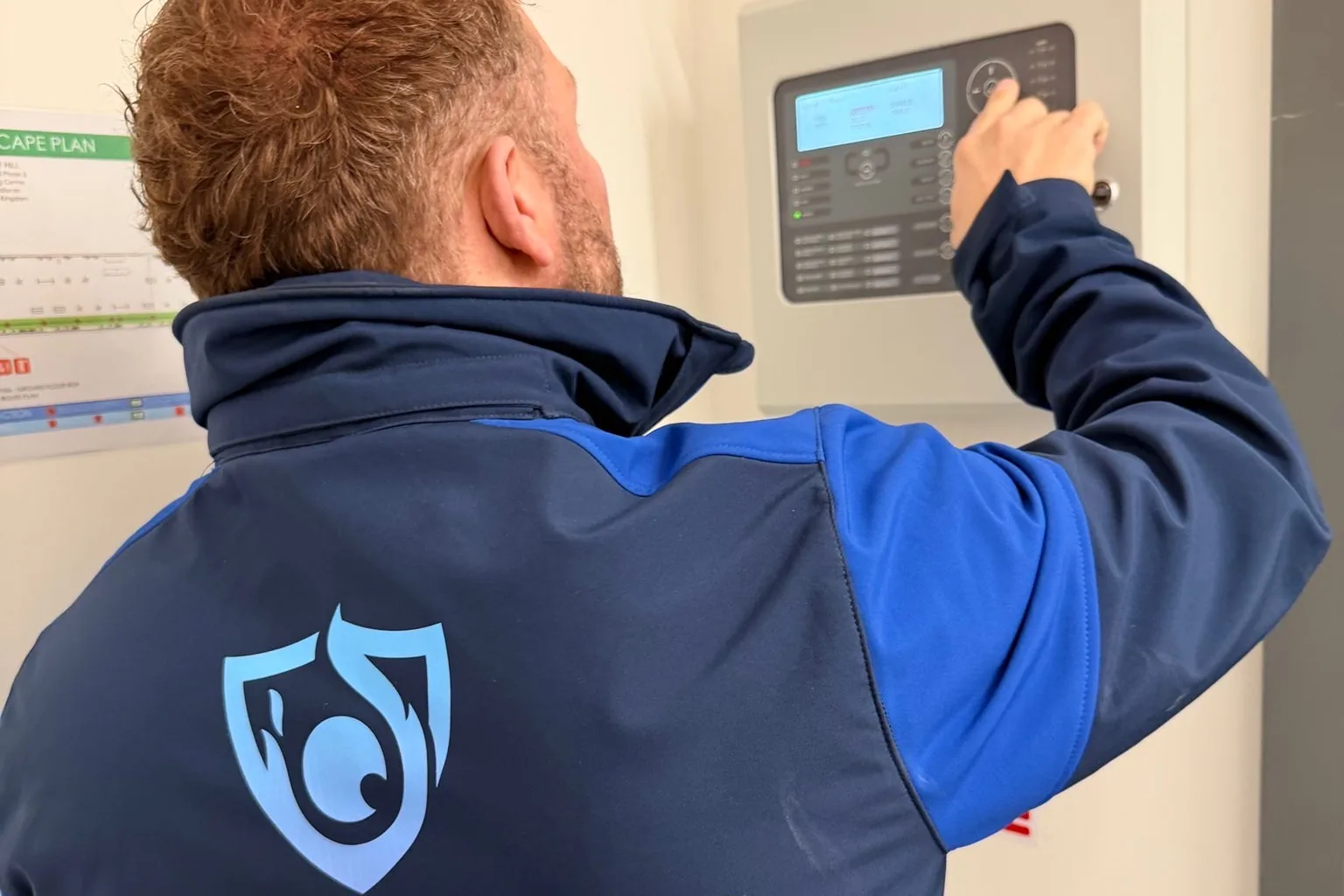 SAFE engineer testing a fire alarm panel